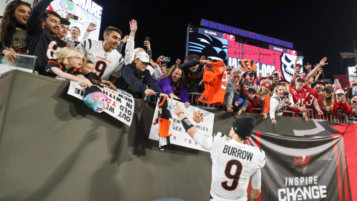 Dec 18, 2022; Tampa, Florida, USA; Cincinnati Bengals quarterback Joe Burrow (9) greet the fans after beating the Tampa Bay Buccaneers at Raymond James Stadium. Mandatory Credit: Nathan Ray Seebeck-USA TODAY Sports Dec 18, 2022; Tampa, Florida, USA; Cincinnati Bengals quarterback Joe Burrow (9) greet the fans after beating the Tampa Bay Buccaneers at Raymond James Stadium. Mandatory Credit: Nathan Ray Seebeck-USA TODAY Sports