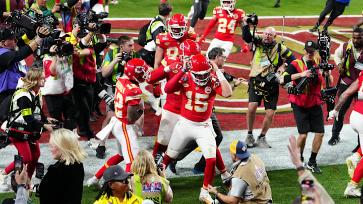 Feb 11, 2024; Paradise, Nevada, USA; Kansas City Chiefs quarterback Patrick Mahomes (15) celebrates after throwing the winning touchdown to wide receiver Mecole Hardman Jr. (12) during overtime against the San Francisco 49ers in Super Bowl LVIII at Allegiant Stadium. Mandatory Credit: Stephen R. Sylvanie-USA TODAY Sports