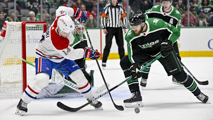 Dec 23, 2022; Dallas, Texas, USA; Montreal Canadiens center Nick Suzuki (14) and Dallas Stars