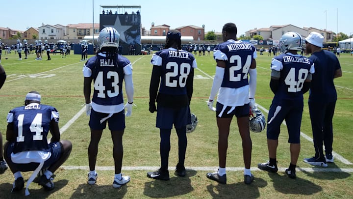Dallas Cowboys defenders Markquese Bell, Kemon Hall, Malik Hooker, Israel Mukuamu, and Zion Childress watch from the sidelines at training camp Dallas Cowboys defenders Markquese Bell, Kemon Hall, Malik Hooker, Israel Mukuamu, and Zion Childress watch from the sidelines at training camp