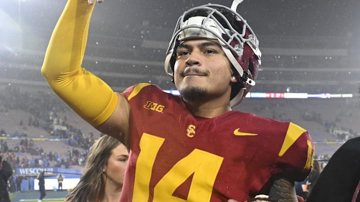 Nov 23, 2024; Pasadena, California, USA;  USC Trojans quarterback Jayden Maiava (14) celebrates the win over UCLA at Rose Bowl. Mandatory Credit: Robert Hanashiro-Imagn Images