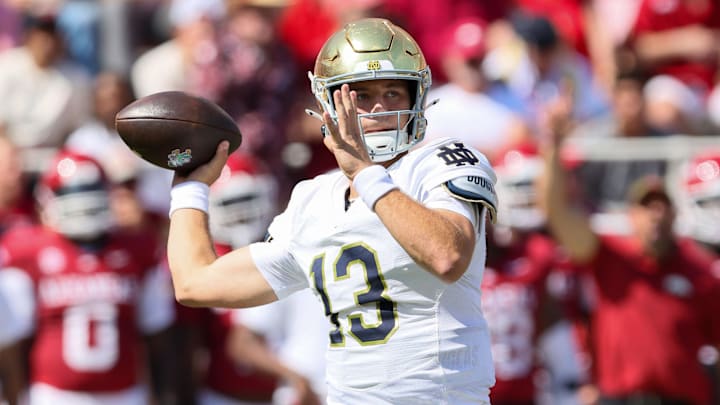 Sep 27, 2025; Fayetteville, Arkansas, USA; Notre Dame Fighting Irish quarterback CJ Carr (13) looks to pass in the second quarter against the Arkansas Razorbacks at Donald W. Reynolds Razorback Stadium Sep 27, 2025; Fayetteville, Arkansas, USA; Notre Dame Fighting Irish quarterback CJ Carr (13) looks to pass in the second quarter against the Arkansas Razorbacks at Donald W. Reynolds Razorback Stadium