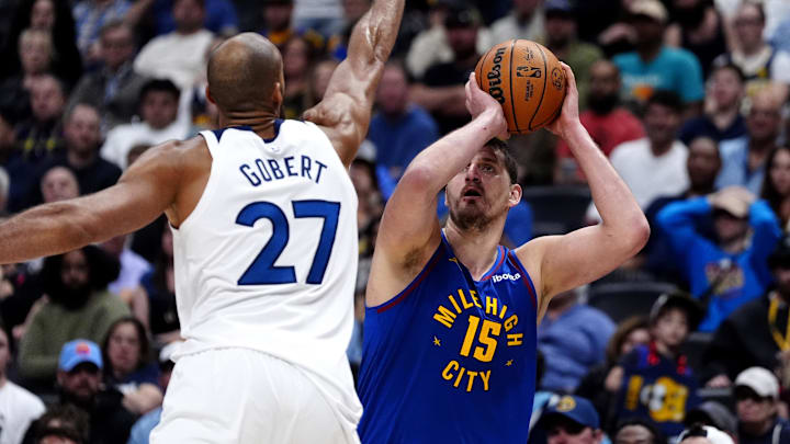 Mar 1, 2026; Denver, Colorado, USA; Minnesota Timberwolves center Rudy Gobert (27) defends on Denver Nuggets center Nikola Jokic (15) in the second half at Ball Arena.