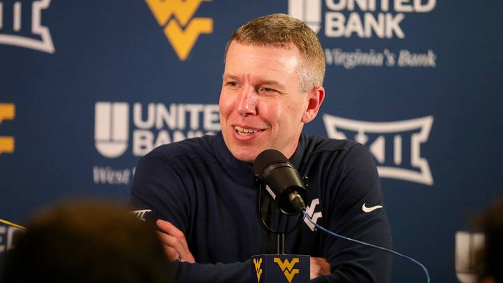 Mar 6, 2026; Morgantown, West Virginia, USA; West Virginia Mountaineers head coach Ross Hodge speaks to the media after defeating the UCF Knights at Hope Coliseum. Mandatory Credit: Ben Queen-Imagn Images Mar 6, 2026; Morgantown, West Virginia, USA; West Virginia Mountaineers head coach Ross Hodge speaks to the media after defeating the UCF Knights at Hope Coliseum. Mandatory Credit: Ben Queen-Imagn Images