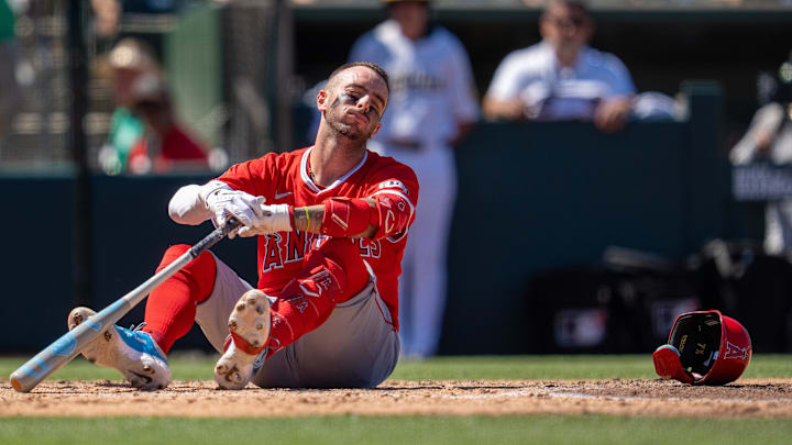 Aug 17, 2025; West Sacramento, California, USA; Los Angeles Angels shortstop Zach Neto (9) on the ground in pain after fouling a ball of his toe during the sixth inning against the Athletics at Sutter Health Park. Mandatory Credit: Neville E. Guard-Imagn Images