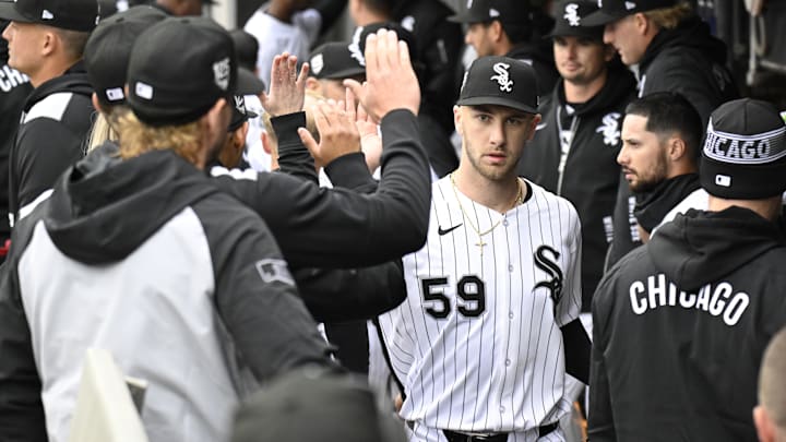 Chicago White Sox pitcher Sean Burke (59) celebrates in the dugout after the first inning against the Los Angeles Angels at Rate Field. 