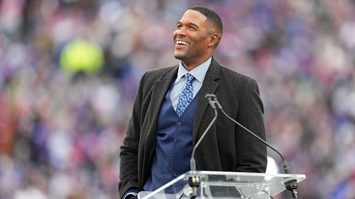 Sep 18, 2022; East Rutherford, NJ, USA;  New York Giants former player Michael Strahan reacts at his jersey retirement ceremony at halftime of a game against the Carolina Panthers at MetLife Stadium.  
