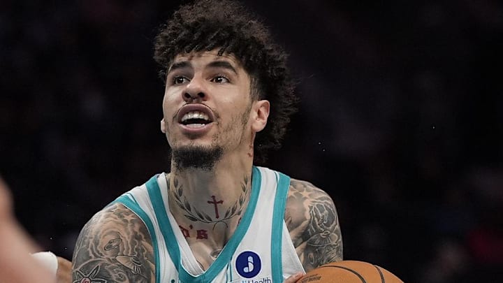 Oct 30, 2025; Charlotte, North Carolina, USA;  Charlotte Hornets guard LaMelo Ball (1) drives to the basket against Orlando Magic guard Anthony Black during the second half at Spectrum Center. Mandatory Credit: Jim Dedmon-Imagn Images