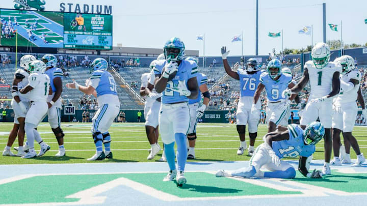 Tulane Green Wave running back Trey Cornist (24) scores a touchdown against the South Florida Bulls during the second half of a football game at Yulman Stadium in New Orleans, Saturday, Sept. 28, 2024. Tulane Green Wave running back Trey Cornist (24) scores a touchdown against the South Florida Bulls during the second half of a football game at Yulman Stadium in New Orleans, Saturday, Sept. 28, 2024.