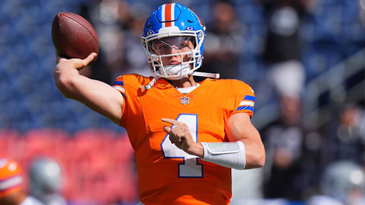 Oct 6, 2024; Denver, Colorado, USA; Denver Broncos quarterback Zach Wilson (4) warms up before the game against the Las Vegas Raiders at Empower Field at Mile High. 