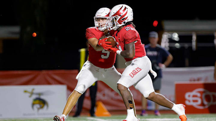 Milton running back TJ Lester (21) added 143 yards and two touchdowns to his 2024 rushing totals last Friday. He is a candidate for this week's North Georgia high school football Player of the Week.