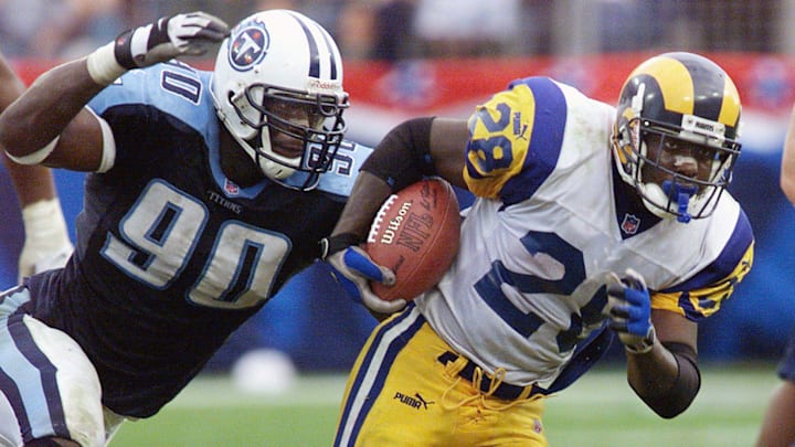 Tennessee Titans star rookie Jevon Kearse chases down Marshall Faulk of the St. Louis Rams during the Titans 24-21 victory at the Adelpha Coliseum in Nashville Oct. 31, 1999.

Tennessee Titans Vs St Louis Rams Football