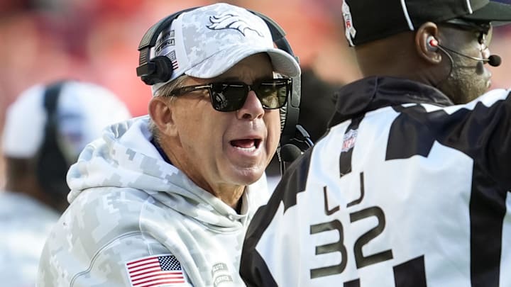Nov 10, 2024; Kansas City, Missouri, USA; Denver Broncos head coach Sean Payton talks to line judge Jeff Bergman (32) during the second half against the Kansas City Chiefs at GEHA Field at Arrowhead Stadium. 