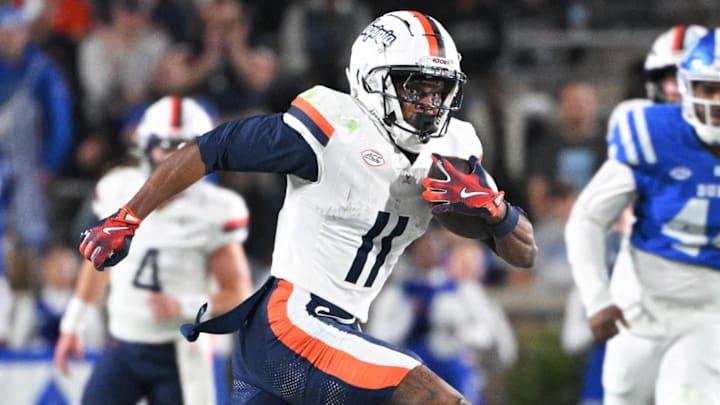 Former Virginia receiver Trell Harris darts into the open field after a catch against Duke.