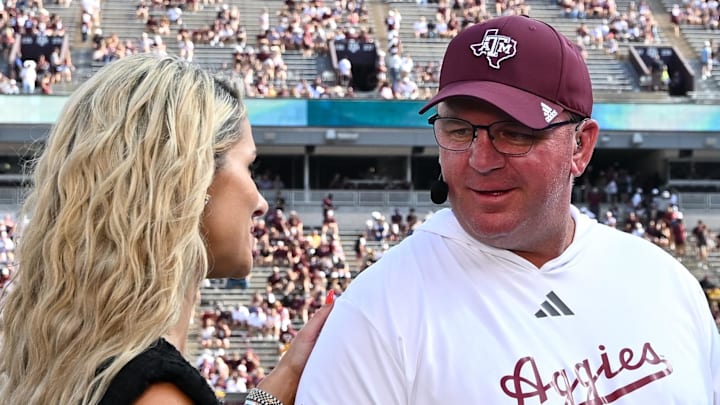 Oct 5, 2024; College Station, Texas, USA; SEC Nation host Laura speaks with Texas A&M Aggies head coach Mike Elko prior to the game between the Texas A&M Aggies and the Missouri Tigers at Kyle Field.