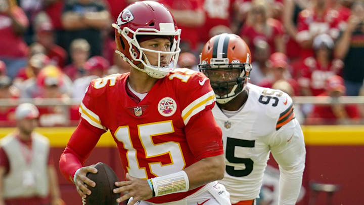 Sep 12, 2021; Kansas City, Missouri, USA; Kansas City Chiefs quarterback Patrick Mahomes (15) throws a pass as Cleveland Browns defensive end Myles Garrett (95) defends at GEHA Field at Arrowhead Stadium. Mandatory Credit: Jay Biggerstaff-Imagn Images