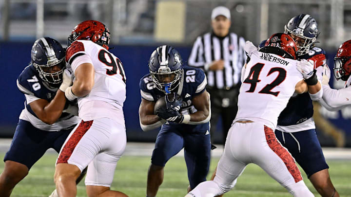 Nevada's Caleb Ramseur finds a hole to run the ball through against San Diego State at Mackay Stadium on Saturday, Oct. 11, 2025. Nevada's Caleb Ramseur finds a hole to run the ball through against San Diego State at Mackay Stadium on Saturday, Oct. 11, 2025.