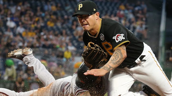 David Peralta slides to score a run on a wild pitch by Pittsburgh Pirates relief pitcher Anthony Banda.