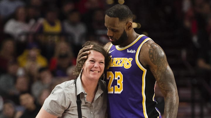 LeBron James shared a moment with a waitress after accidentally knocking her down during a game against the Portland Trail Blazers at Moda Center in 2019.