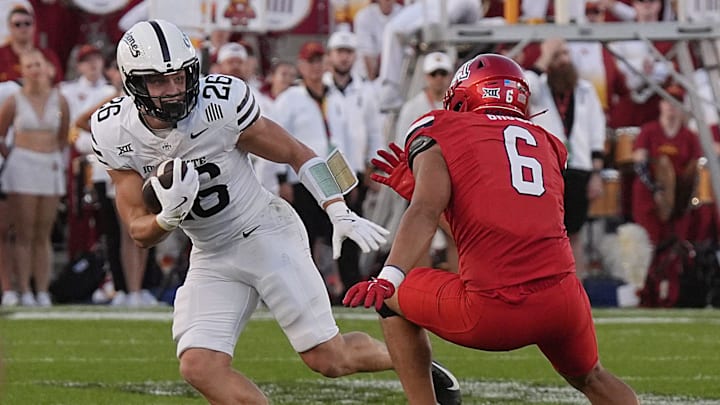 Iowa State Cyclones' running back Carson Hansen (26) runs with the ball after making a catch around Arizona Wildcats linebacker Taye Brown (6) during the first quarter in the Big-12 conference showdown on Sept. 27, 2025, at Jack Trice Stadium in Ames, Iowa.