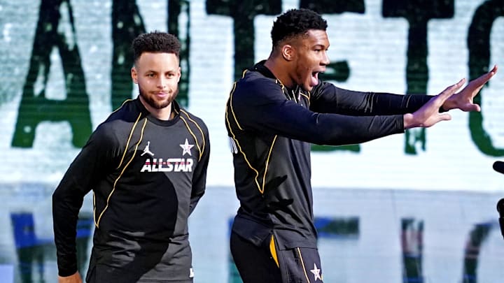 Team LeBron guard Stephen Curry of the Golden State Warriors (30) and Team LeBron forward Giannis Antetokounmpo of the Milwaukee Bucks (34)  before the 2021 NBA All-Star Game at State Farm Arena. Mandatory Credit: Dale Zanine-Imagn Images