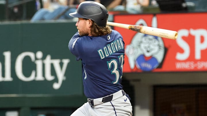 Apr 7, 2026; Arlington, Texas, USA; Seattle Mariners third baseman Brendan Donovan (33) hits a single during the third inning against the Texas Rangers at Globe Life Field. Mandatory Credit: Kevin Jairaj-Imagn Images