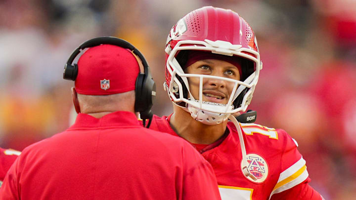 Sep 28, 2025; Kansas City, Missouri, USA; Kansas City Chiefs quarterback Patrick Mahomes (15) talks with head coach Andy Reid during the second half against the Baltimore Ravens at GEHA Field at Arrowhead Stadium. Mandatory Credit: Jay Biggerstaff-Imagn Images