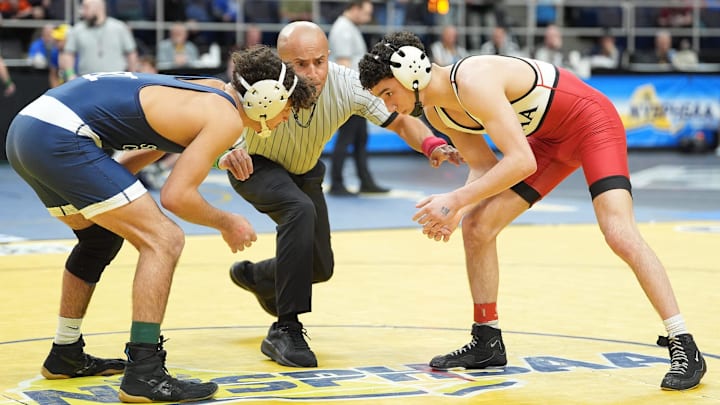 Bellport’s Camryn Howard, right, wrestles Iona Prep’s Vinny Tripaldi at the New York State wrestling championship tournament during the 2024-25 season.
