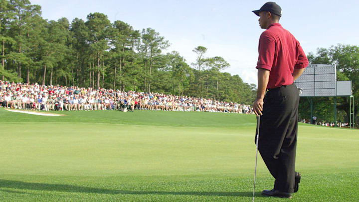April 14, 2002; Augusta, GA, USA; Tiger Woods waits to finish putting before winning his third Masters on the 18th hole. April 14, 2002; Augusta, GA, USA; Tiger Woods waits to finish putting before winning his third Masters on the 18th hole.