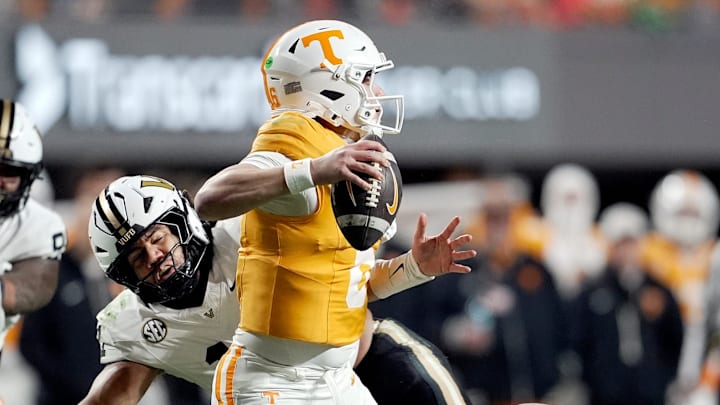 Vanderbilt linebacker Bryan Longwell (11) tries to sack Tennessee quarterback Joey Aguilar (6) during the third quarter at Neyland Stadium in Knoxville, Tenn., Saturday, Nov. 29, 2025. Vanderbilt linebacker Bryan Longwell (11) tries to sack Tennessee quarterback Joey Aguilar (6) during the third quarter at Neyland Stadium in Knoxville, Tenn., Saturday, Nov. 29, 2025.