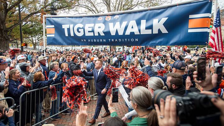 Auburn football head coach Alex Golesh is welcomed during a Tiger Walk at Jordan-Hare Stadium in Auburn, Ala.