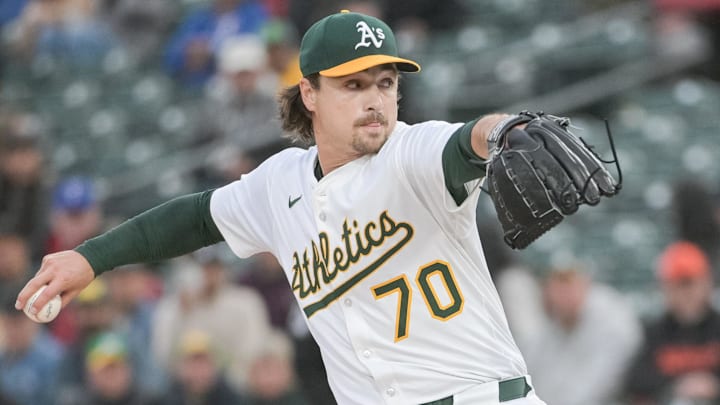 Apr 24, 2025; West Sacramento, California, USA; Athletics pitcher J.T. Ginn (70) throws a pitch against the Texas Rangers during the first inning at Sutter Health Park. Mandatory Credit: Ed Szczepanski-Imagn Images
