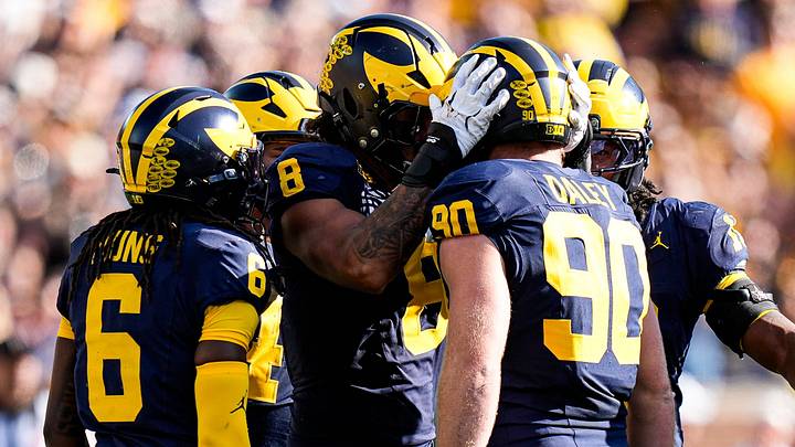 Michigan defensive end Dom Nichols (8), left, and defensive end John Henry Daley (90) celebrates a play against Iowa during the first half at Michigan Stadium in Ann Arbor on Saturday, Sept. 26, 2026. Michigan defensive end Dom Nichols (8), left, and defensive end John Henry Daley (90) celebrates a play against Iowa during the first half at Michigan Stadium in Ann Arbor on Saturday, Sept. 26, 2026.