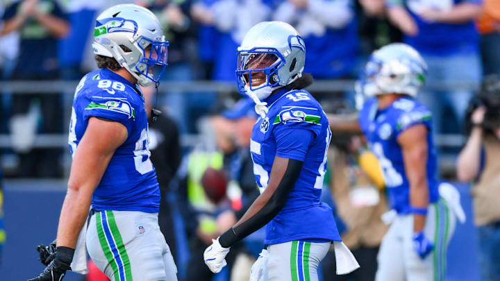 Oct 5, 2025; Seattle, Washington, USA; Seattle Seahawks wide receiver Tory Horton (15) is congratulated by tight end AJ Barner (88) after catching a touchdown pass against the Tampa Bay Buccaneers during the second half at Lumen Field. 