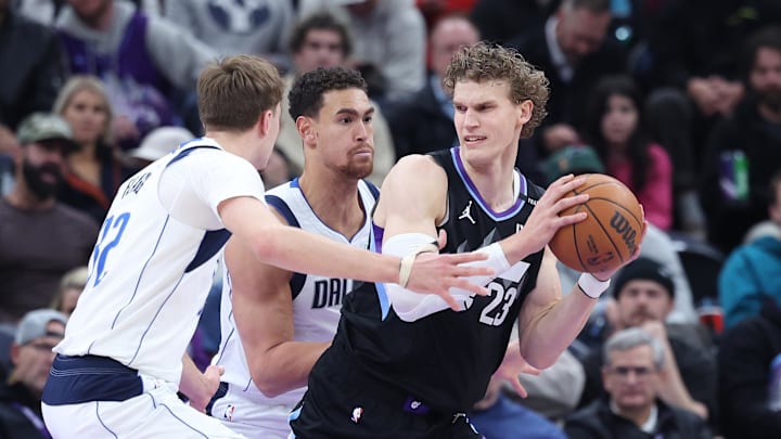 Dec 15, 2025; Salt Lake City, Utah, USA; Utah Jazz forward Lauri Markkanen (23) prepares to shoot against Dallas Mavericks forward Dwight Powell (7) and forward Cooper Flagg (32) during the first quarter at Delta Center. Mandatory Credit: Rob Gray-Imagn Images Dec 15, 2025; Salt Lake City, Utah, USA; Utah Jazz forward Lauri Markkanen (23) prepares to shoot against Dallas Mavericks forward Dwight Powell (7) and forward Cooper Flagg (32) during the first quarter at Delta Center. Mandatory Credit: Rob Gray-Imagn Images