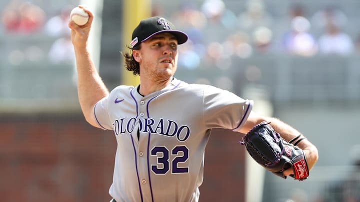 Jun 14, 2025; Cumberland, Georgia, USA; Colorado Rockies pitcher Chase Dollander (32) pitches the ball against the Atlanta Braves during the first inning at Truist Park