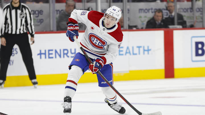 Dec 20, 2024; Detroit, Michigan, USA; Montreal Canadiens defenseman Lane Hutson (48) handles the puck during the third period at Little Caesars Arena. Mandatory Credit: Brian Bradshaw Sevald-Imagn Images Dec 20, 2024; Detroit, Michigan, USA; Montreal Canadiens defenseman Lane Hutson (48) handles the puck during the third period at Little Caesars Arena. Mandatory Credit: Brian Bradshaw Sevald-Imagn Images