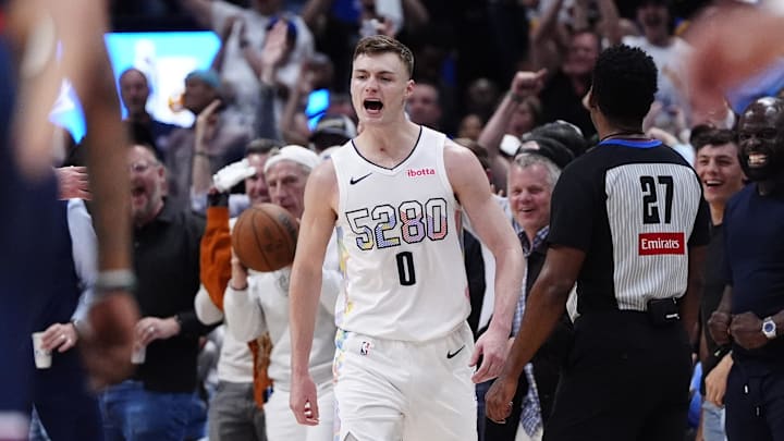 Apr 29, 2025; Denver, Colorado, USA; Denver Nuggets guard Christian Braun (0) reacts in the fourth quarter against the LA Clippers during game five of the first round for the 2025 NBA Playoffs at Ball Arena. Mandatory Credit: Ron Chenoy-Imagn Images