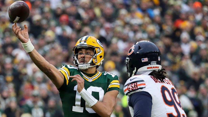 Jordan Love locates a receiver before Gervon Dexter's rush can arrive in Green Bay's 17-9 season-ending win in January.