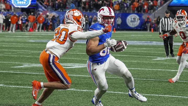 Dec 7, 2024; Charlotte, NC, USA; Southern Methodist Mustangs tight end Matthew Hibner (88) runs after a catch against Clemson Tigers cornerback Avieon Terrell (20) during the fourth quarter in the 2024 ACC Championship game at Bank of America Stadium. Mandatory Credit: Jim Dedmon-Imagn Images