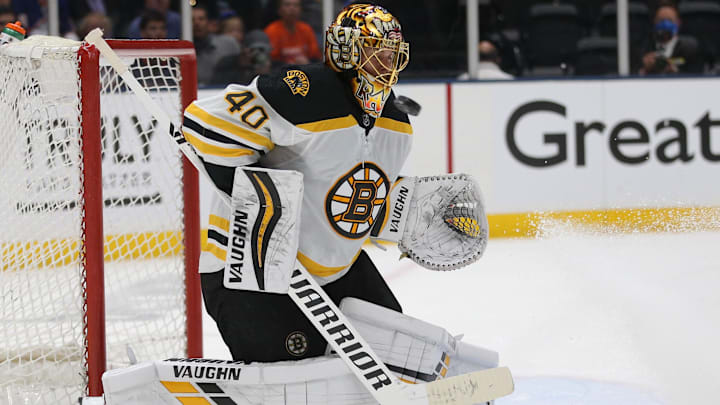 Jun 3, 2021; Uniondale, New York, USA; Boston Bruins goalie Tuukka Rask (40) plays the puck against the New York Islanders during the second period of game three of the second round of the 2021 Stanley Cup Playoffs at Nassau Veterans Memorial Coliseum. Mandatory Credit: Brad Penner-Imagn Images
