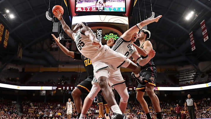 Michigan State forward Coen Carr (55) and forward Jaxon Kohler (0) jump for the ball during the second half against Minnesota at Williams Arena in Minneapolis on Dec. 4, 2024. Michigan State forward Coen Carr (55) and forward Jaxon Kohler (0) jump for the ball during the second half against Minnesota at Williams Arena in Minneapolis on Dec. 4, 2024.