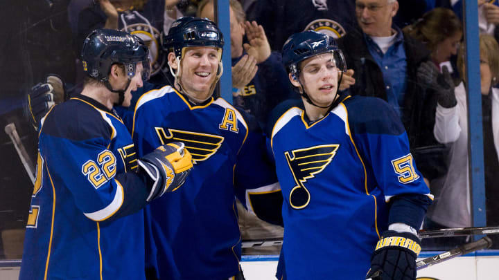 February 7, 2009; St, Louis, MO, USA; St. Louis Blues center Keith Tkachuk (7) celebrates with teammates right wing Brad Boyes (22) and left wing David Perron (57) after scoring a goal in the second period against the Colorado Avalanche at the Scottrade Center. Mandatory Credit: Jeff Curry-USA TODAY Sports