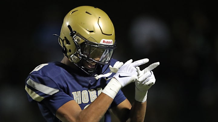 Hoban wide receiver Elbert Hill IV acknowledges the crowd after his touchdown against Walsh Jesuit during the first half of a high school football game, Friday, Sept. 29, 2023, in Akron, Ohio.