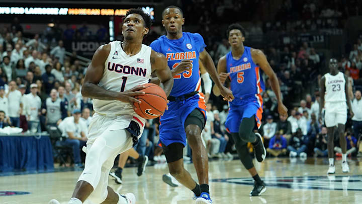 Nov 17, 2019; Storrs, CT, USA; Connecticut Huskies guard Christian Vital (1) prepares to shoot the ball past Florida Gators guard Scottie Lewis (23) in the first half at Harry A. Gampel Pavilion. Mandatory Credit: David Butler II-Imagn Images Nov 17, 2019; Storrs, CT, USA; Connecticut Huskies guard Christian Vital (1) prepares to shoot the ball past Florida Gators guard Scottie Lewis (23) in the first half at Harry A. Gampel Pavilion. Mandatory Credit: David Butler II-Imagn Images