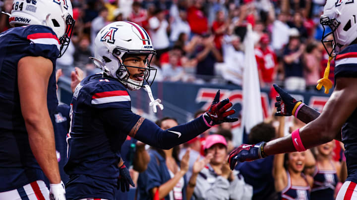 Oct 11, 2025; Tucson, Arizona, USA; Arizona Wildcats wide receiver Kris Hutson (4) celebrates a touchdown he made during the first quarter of the game against the Brigham Young Cougars at Arizona Stadium. Mandatory Credit: Aryanna Frank-Imagn Images