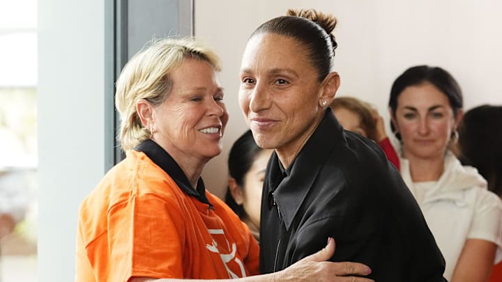 WNBA All-Star Diana Taurasi receives a hug from Ann Meyers Drysdale before her retirement news conference at the Phoenix Mercury's practice facility on March 13, 2025. WNBA All-Star Diana Taurasi receives a hug from Ann Meyers Drysdale before her retirement news conference at the Phoenix Mercury's practice facility on March 13, 2025.
