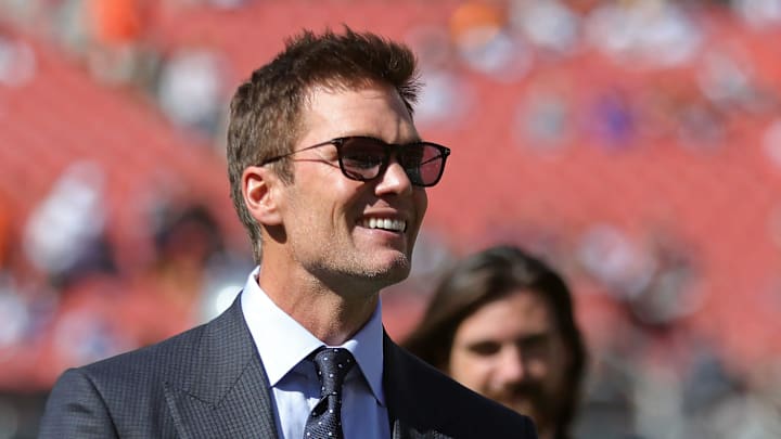 NFL legend Tom Brady is all smiles before an NFL football game at Huntington Bank Field, Sunday, Sept. 8, 2024, in Cleveland, Ohio.