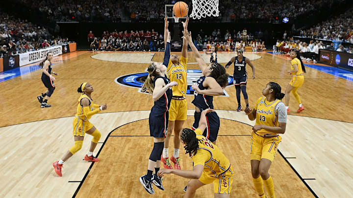 Apr 1, 2024; Portland, OR, USA; USC Trojans guard JuJu Watkins (12) stretches for a rebound against the University of Connecticut Huskies. Apr 1, 2024; Portland, OR, USA; USC Trojans guard JuJu Watkins (12) stretches for a rebound against the University of Connecticut Huskies.