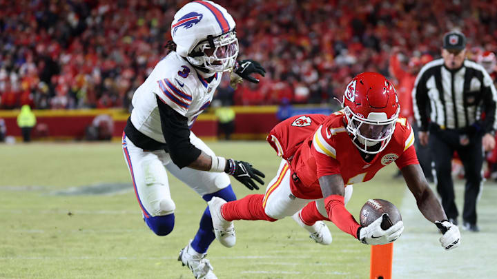 Kansas City Chiefs wide receiver Xavier Worthy (1) dives for a touchdown against Buffalo Bills safety Damar Hamlin (3) during the first half in the AFC Championship game at GEHA Field at Arrowhead Stadium. 